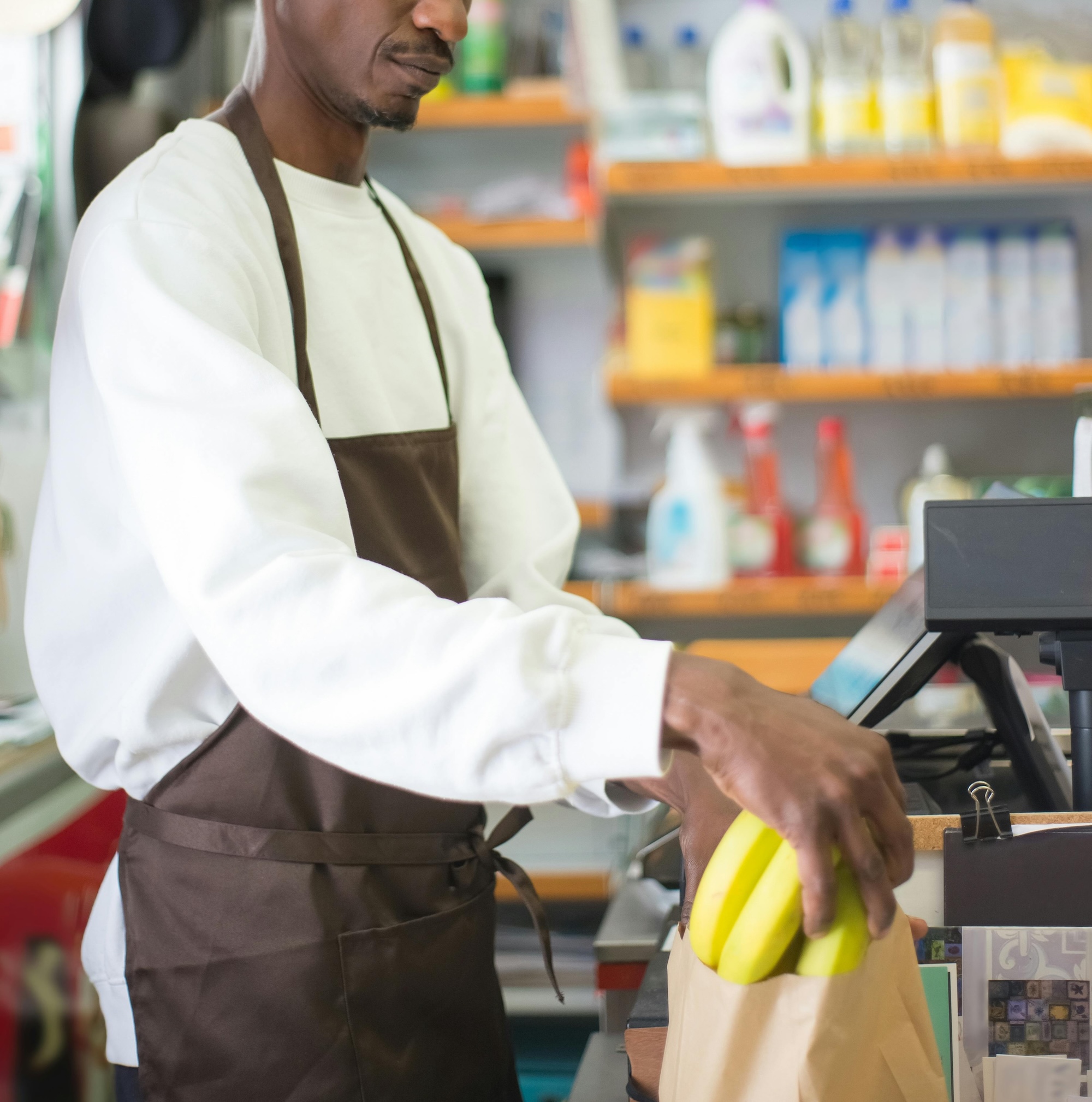 grocery store attendant at checkout