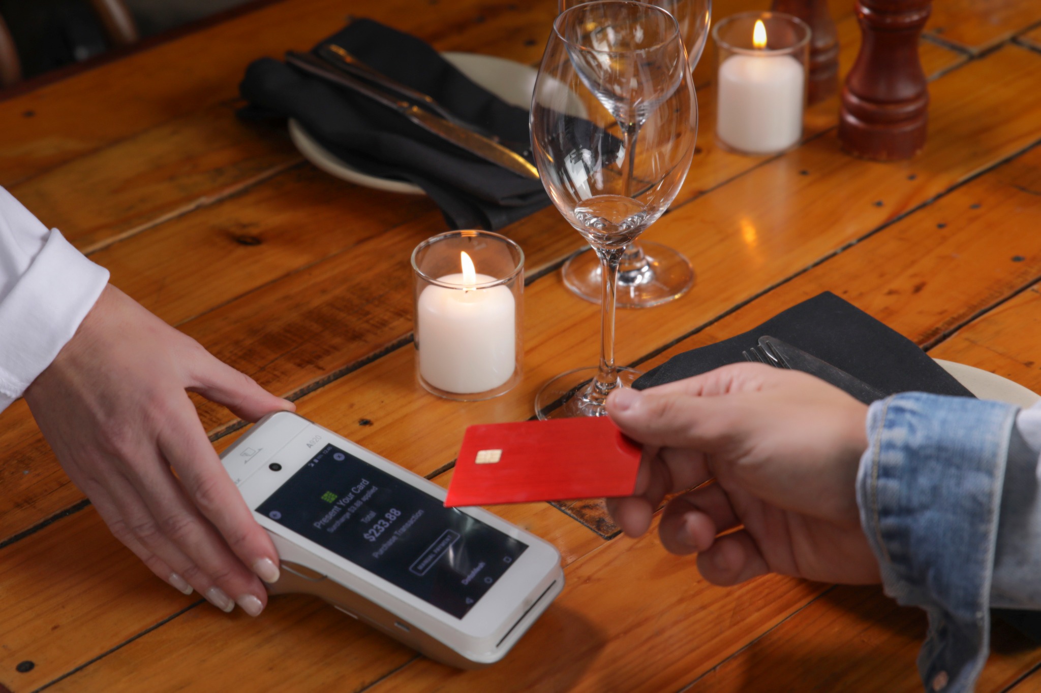 customer at restaurant paying on EFTPOS terminal